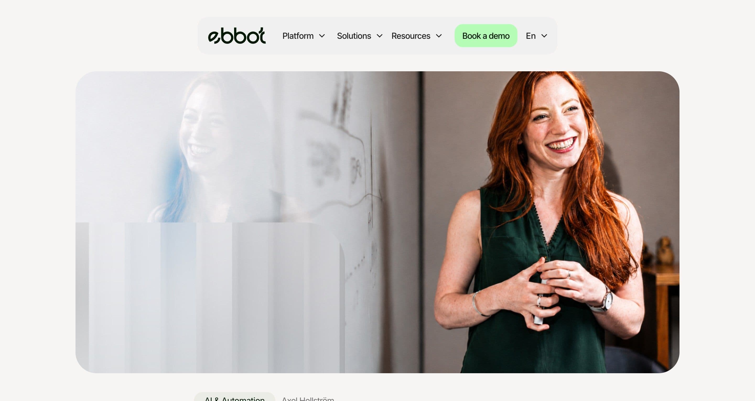A blog post on ebbot.com, a red-haired woman smiling in a bright office above the article