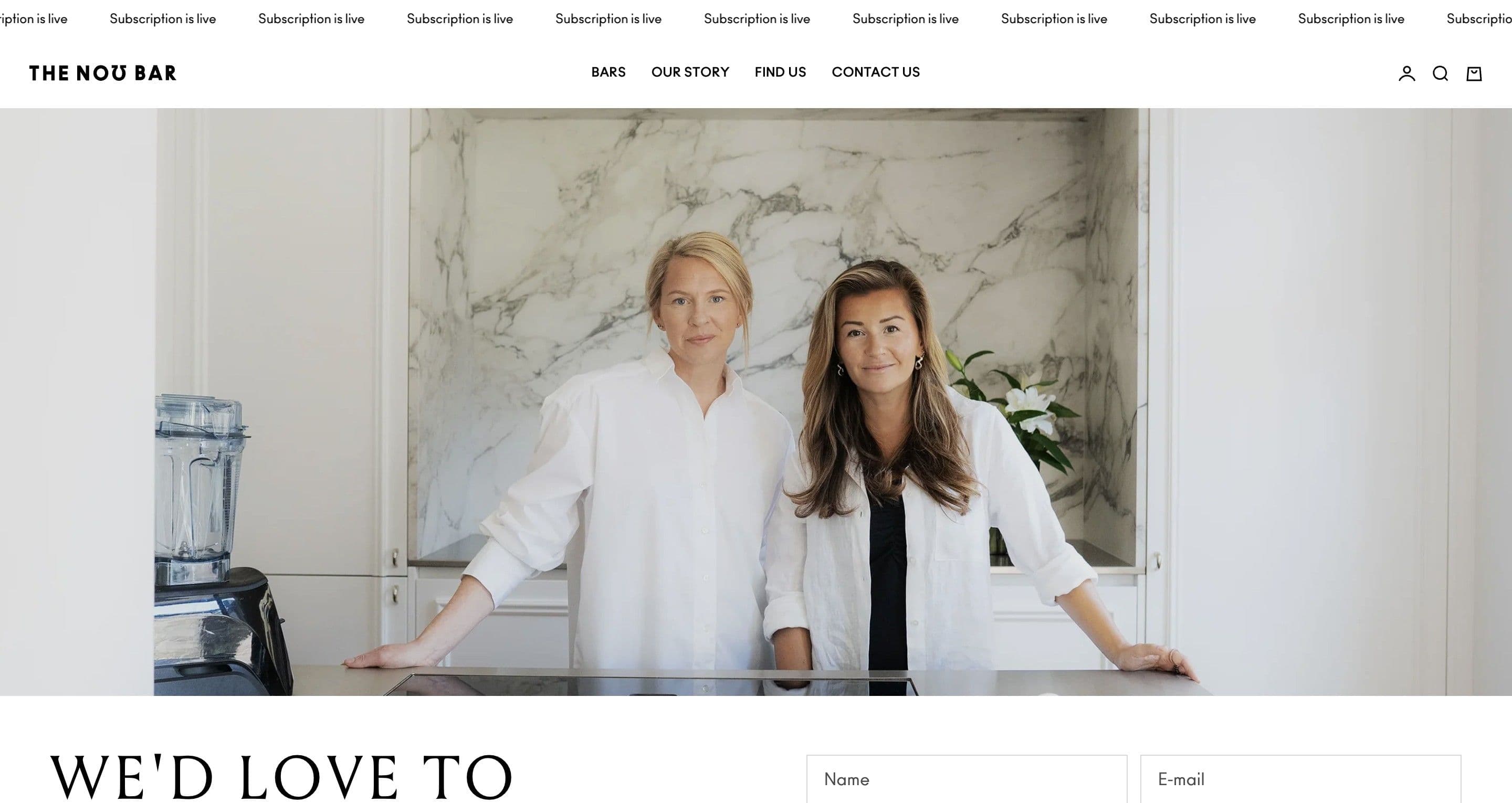 The contact page on thenobar.com, the two founders in white shirts in a marble kitchen